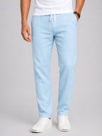 Light blue pants worn by a person on a gray background