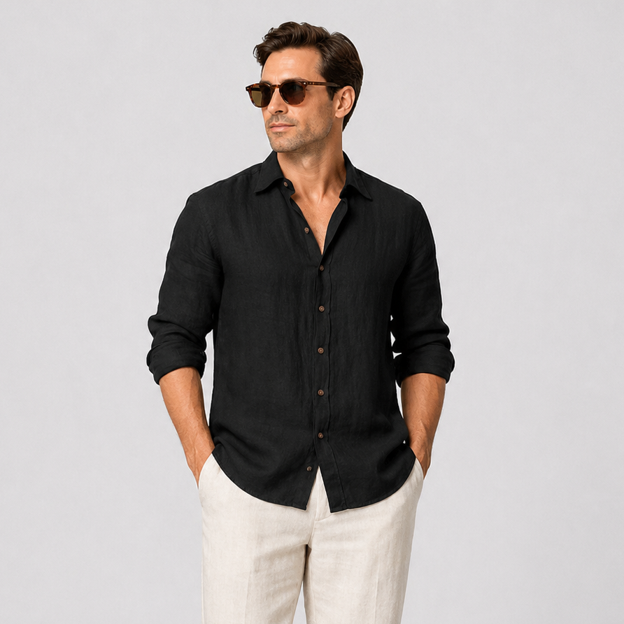 Men's black linen long sleeve button-up shirt with an open collar, paired with light linen trousers.