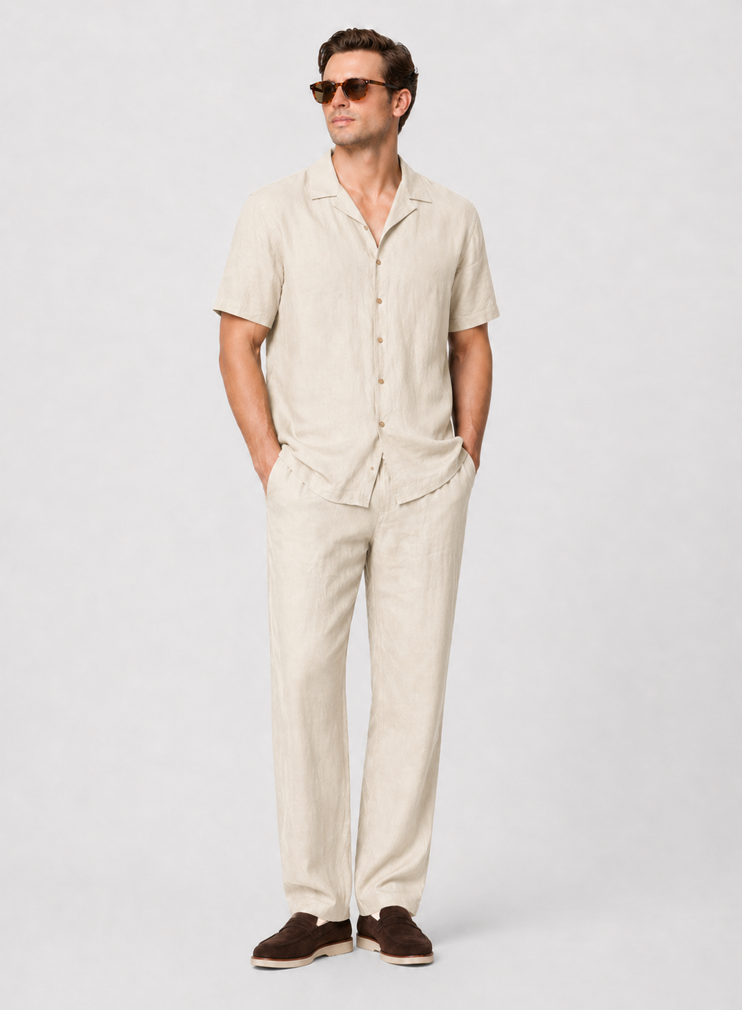 Men's beige linen two-piece set: short-sleeve shirt with open collar and straight-leg pants.