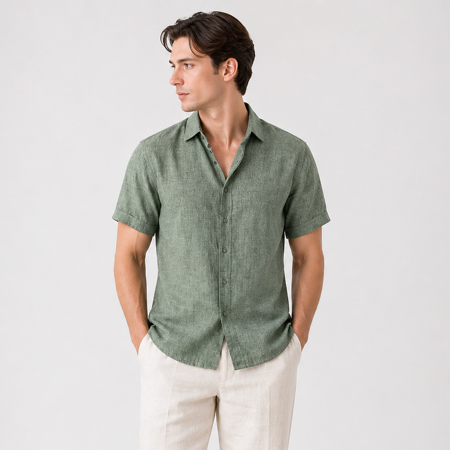 Men's classic short sleeve button-up shirt in olive green, paired with light beige linen trousers.