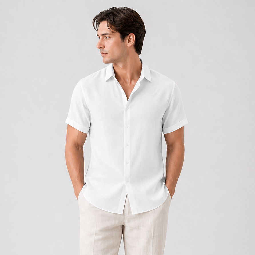 Men's classic white short sleeve button-up shirt with pointed collar, paired with light beige trousers.