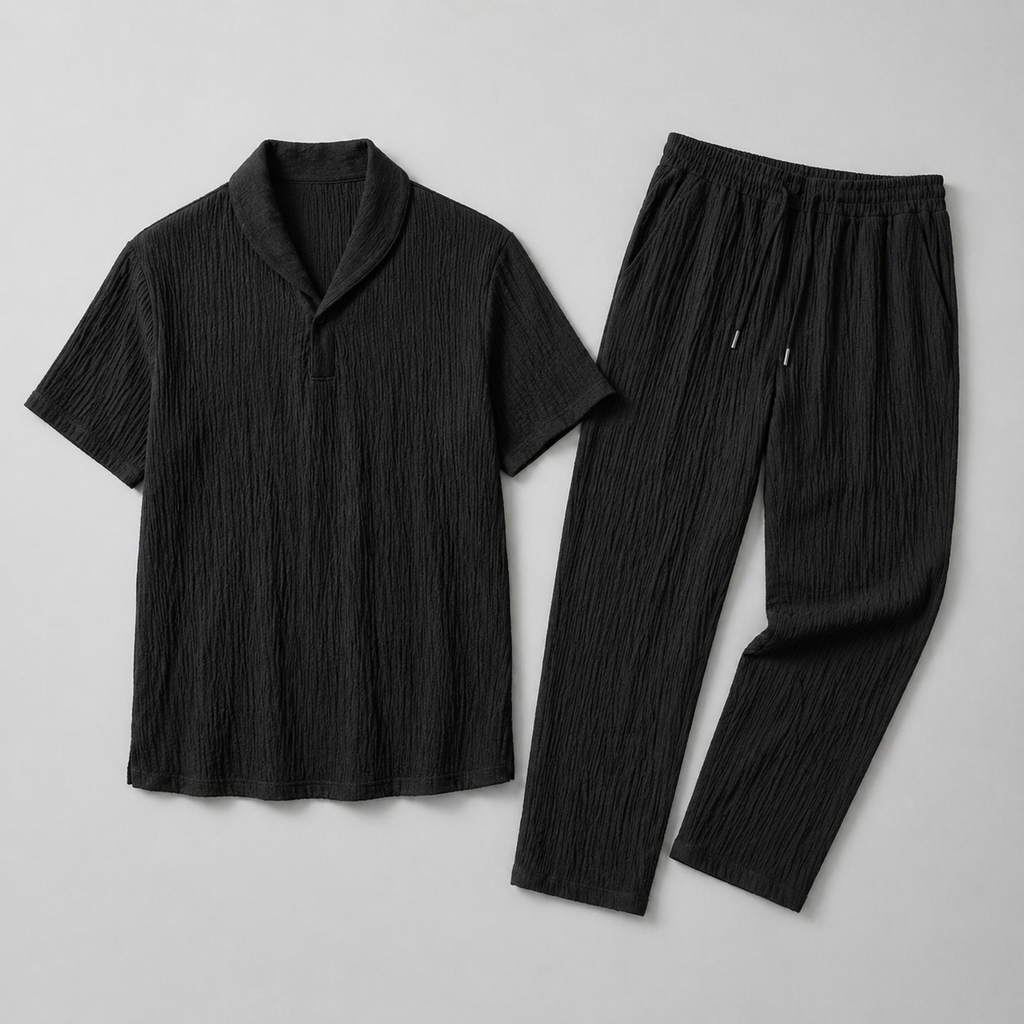 Black t-shirt and pants set on a light gray background