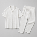 White textured shirt and pants set on a gray background