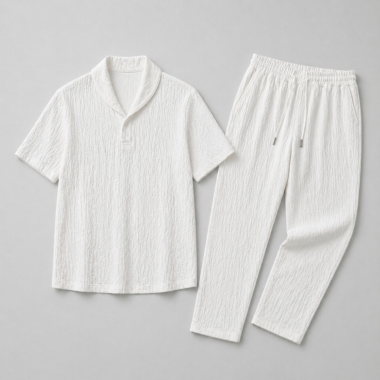 White textured shirt and pants set on a gray background
